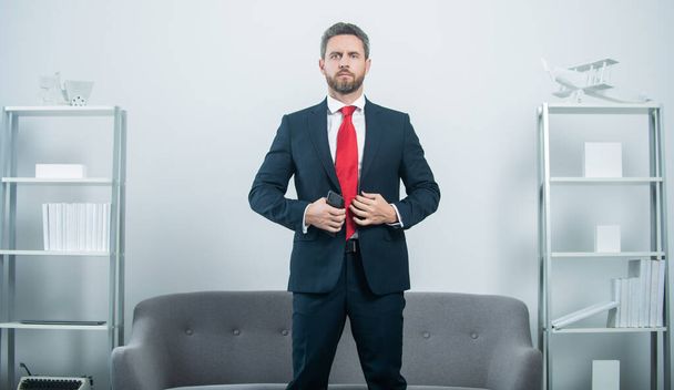 businessman in suit at business office with phone - Photo, Image
