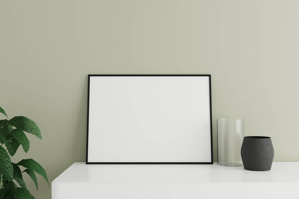 Minimalistische en schone horizontale zwarte poster of fotolijst model op de witte tafel leunend tegen de kamerwand met vaas en plant. 3D-weergave. - Foto, afbeelding