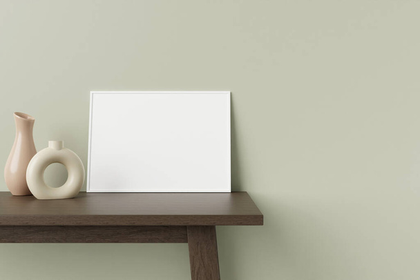 Minimalist and clean horizontal white poster or photo frame mockup on the wooden table leaning against the room wall with decorative vase. 3D Rendering. - Zdjęcie, obraz