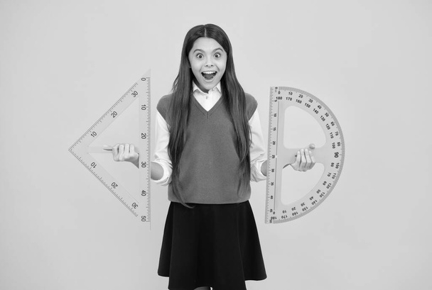 what angle you look. surprised child with triangle. teenage girl with ruler. back to school. - Fotografie, Obrázek