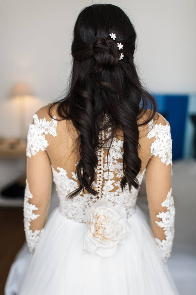Bride's back in the wedding dress. Wedding day. - Photo, Image
