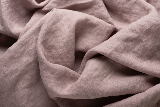 Stonewashed linen fabric in lilac color, sewing concept, selective focus image - Valokuva, kuva
