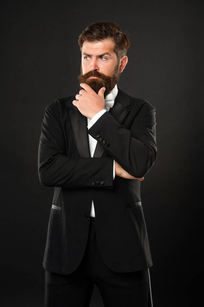 bearded man in tuxedo on black background, menswear - Foto, afbeelding