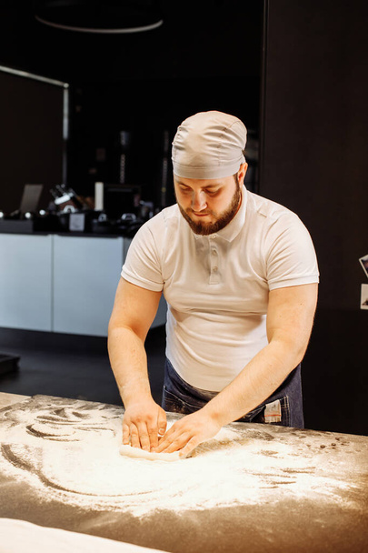 Making dough by hands at bakery or at home. - Φωτογραφία, εικόνα