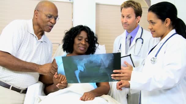 Radiology staff discussing x-ray result with patient - Footage, Video