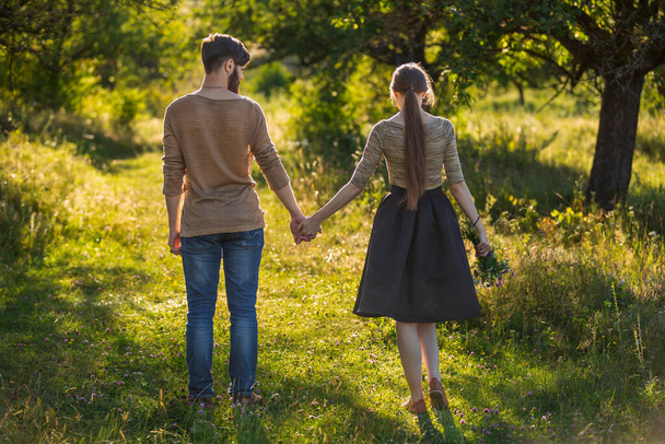 young couple walking in nature - Fotografie, Obrázek