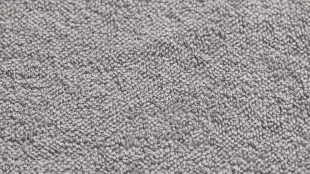 closeup loopable background of gray soft cotton towel - Felvétel, videó