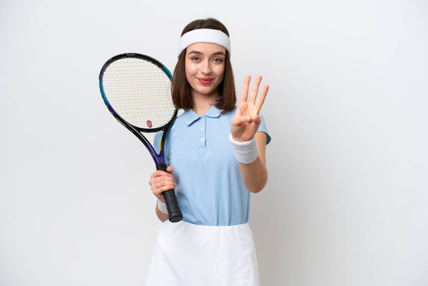 Young Ukrainian tennis player woman isolated on white background happy and counting three with fingers - Photo, Image