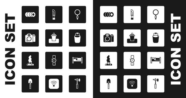 Set Magnifying glass, Trash can, Photo camera, Blanket roll, Bucket, Knife, Bed and Campfire icon. Vector - Vecteur, image