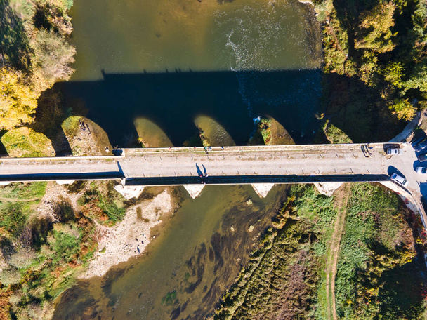 Aerial view of Nineteenth-century bridge over the Yantra River, known as the Kolyu Ficheto Bridge in Byala, Ruse region, Bulgaria - Fotoğraf, Görsel