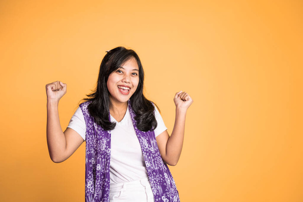 asian woman clenching hands while celebrating success - Photo, image