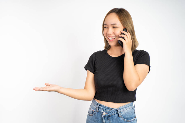 woman hold a mobile phone with hand gesture presenting - Photo, image
