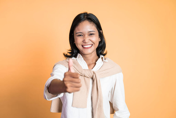 woman stand with thumbs up on isolated background - Фото, изображение