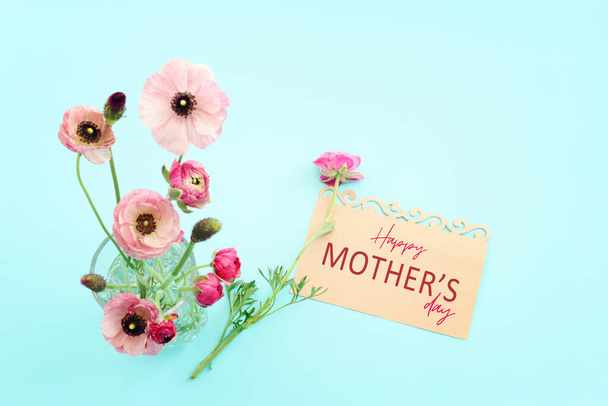 mother's day concept with pink flowers over pastel background - Photo, Image