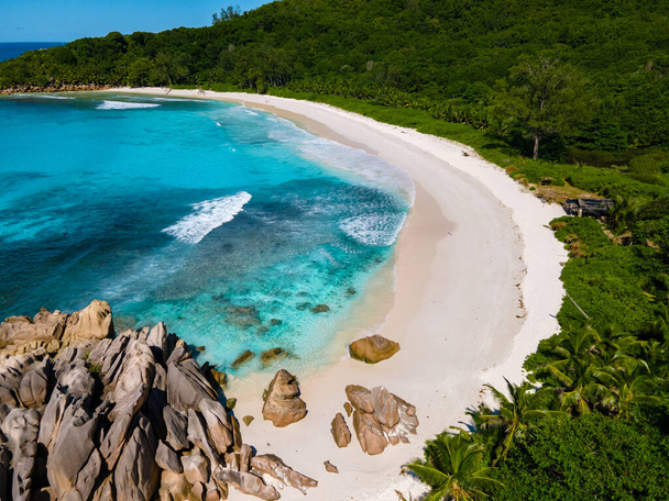Anse Cocos Beach, La Digue Island, Seychelles, Tropical white beach with the turquoise colored ocean. - Фото, изображение