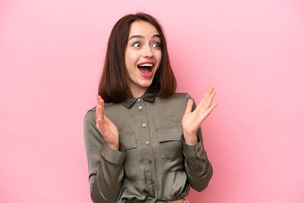 Young Ukrainian woman isolated on pink background with surprise facial expression - Photo, Image