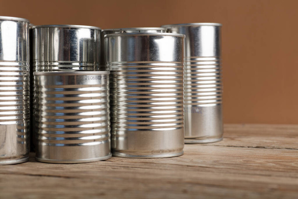 recycled cans, reused on a table with a brown backgroundtop view, space for text. - Fotoğraf, Görsel