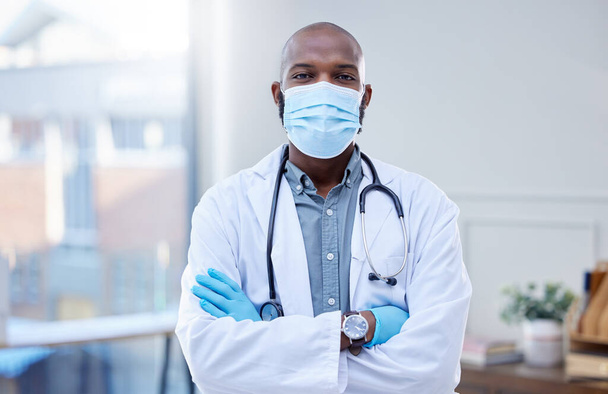The only thing I want to spread is good medical advice. Shot of a male doctor wearing a surgical mask and gloves. - Fotó, kép