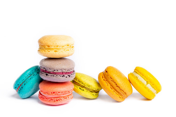 Colorful macaroon cakes. Small french muffins. Colorful macarons on a white background - Foto, Imagem