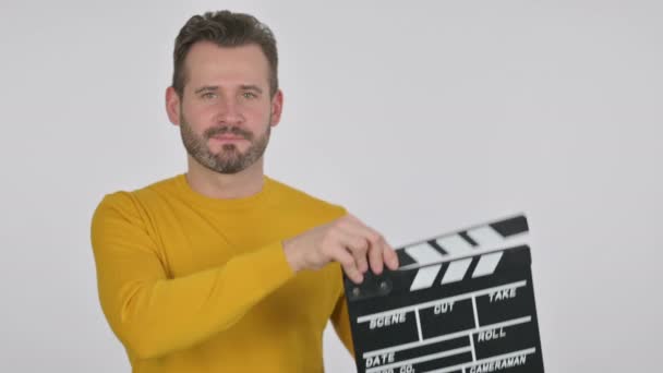 Portrait of Middle Aged Man Using clapperboard - Filmati, video
