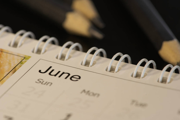 June month calendar. Macro close up. - Foto, Bild