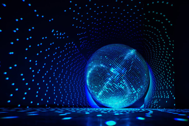 Disco ball reflecting blue light. Copy space. - Photo, Image