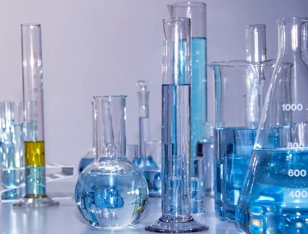Close up of labware such as beaker, flask, graduated cylinders and test tubes well placed - Fotoğraf, Görsel