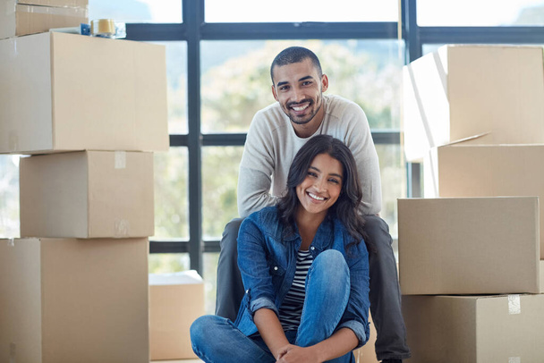 Weve got a lot of unpacking to do. Portrait of a happy young couple moving into their new home together. - 写真・画像