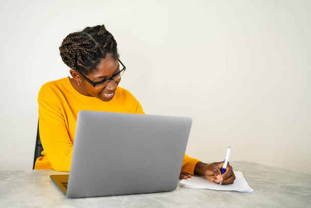 young african american woman telecommuting from home - Photo, image