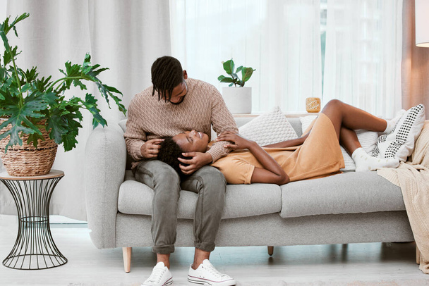 Comfort is where you are. Shot of a young couple relaxing at home. - Fotoğraf, Görsel