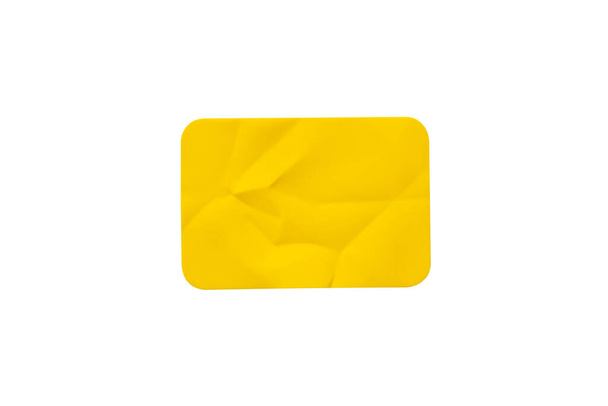 Yellow plastic sticker label isolated on white background - Fotografie, Obrázek