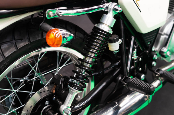 Detail of the suspension springs and turn signals on the rear wheel of a custom motorbike - Фото, изображение