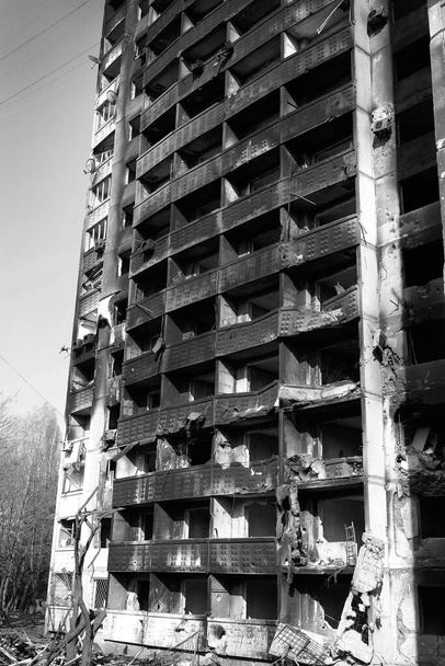 A destroyed high-rise building of people in Kharkov after the shelling of Russian troops. Black and white photo of the war. - Fotografie, Obrázek