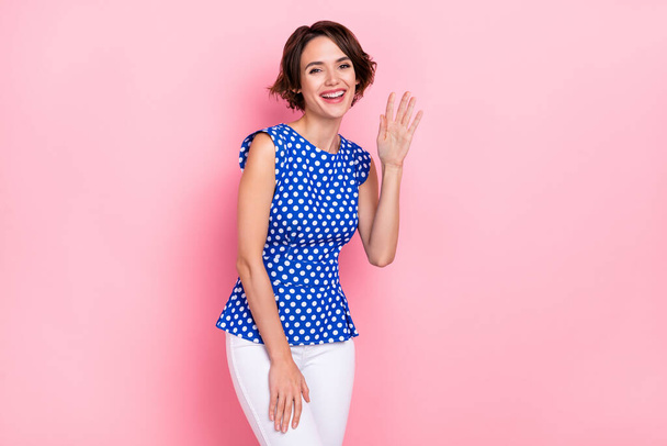 Photo of hooray millennial bob hairdo lady wave wear dotted blouse isolated on pink color background - Fotó, kép