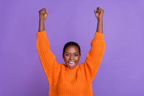 Photo of young cheerful lady rejoice victory fists hands hooray triumph champion isolated over purple color background - Foto, imagen