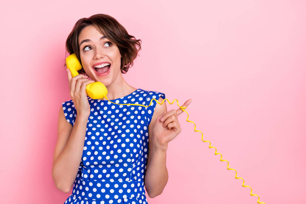 Photo of sweet millennial brunette lady talk telephone look promo wear blue blouse isolated on pink color background - Foto, Imagem
