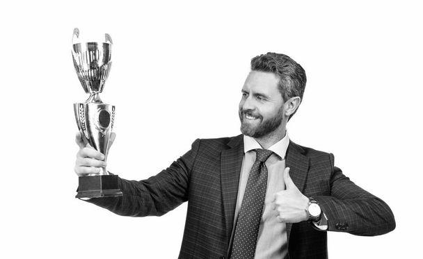 Reward for work. Happy ceo show thumbs up to golden cup. Reward and recognition - Zdjęcie, obraz
