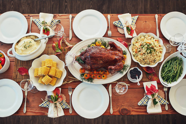 It wont be a feast without the turkey. High angle shot of a dining table with a text overlay. - Fotó, kép