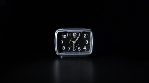 Alarm clock in black background - Materiał filmowy, wideo