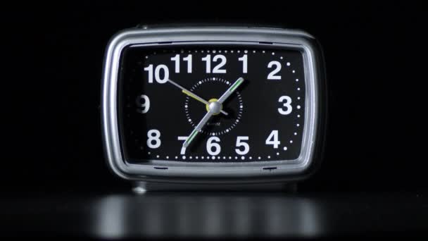 Alarm clock in black background - Materiał filmowy, wideo