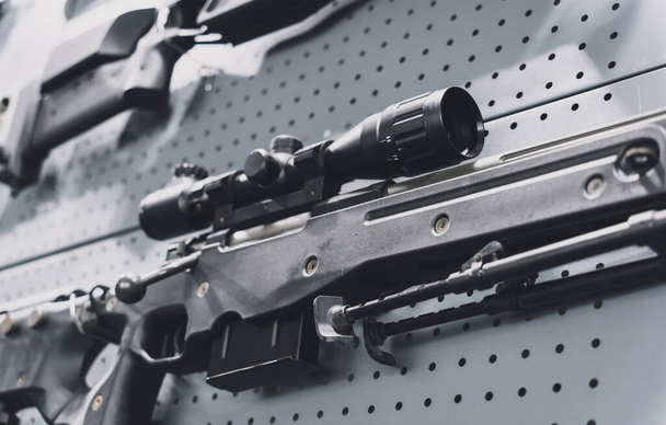 Collection of rifles and carbines on the wall - 写真・画像
