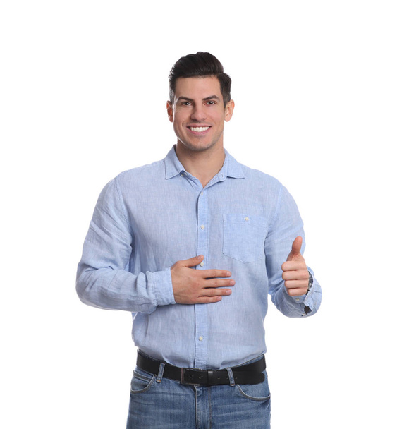 Happy healthy man touching his belly on white background - Φωτογραφία, εικόνα
