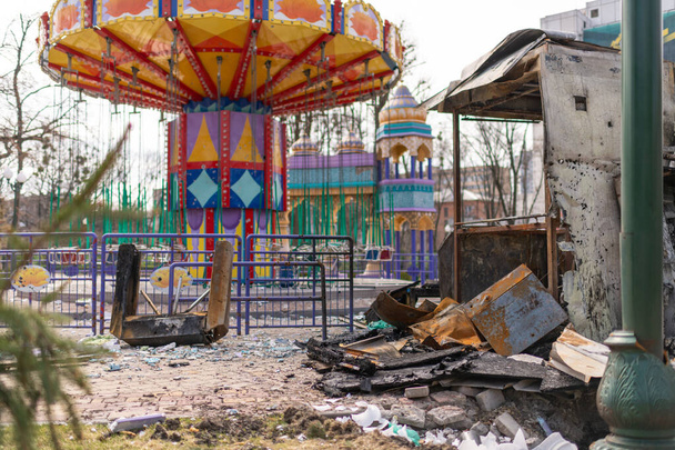 Carousel for children during war in Ukraine shot by Russian soldiers, carousel without children during war on Ukraine, carousel of children upon Ukraine war is must-have attraction in every joy park - 写真・画像