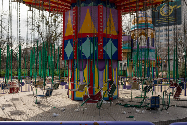 Carousel for children during war in Ukraine shot by Russian soldiers, carousel without children during war on Ukraine, carousel of children upon Ukraine war is must-have attraction in every joy park - Foto, Imagen