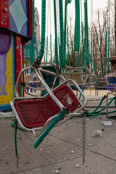 Carousel for children during war in Ukraine shot by Russian soldiers, carousel without children during war on Ukraine, carousel of children upon Ukraine war is must-have attraction in every joy park - Foto, Bild