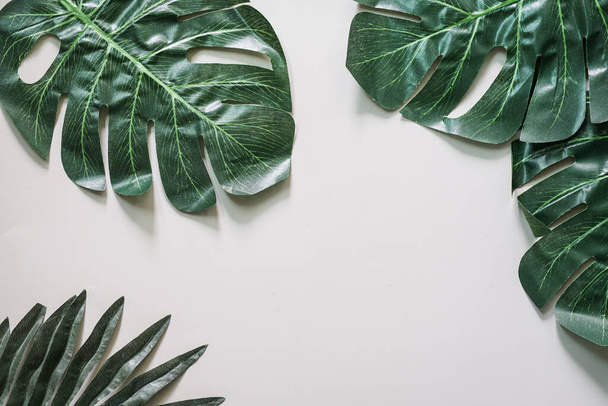 Creative nature layout made of tropical leaves and flowers. Flat lay. Summer concept. - Zdjęcie, obraz
