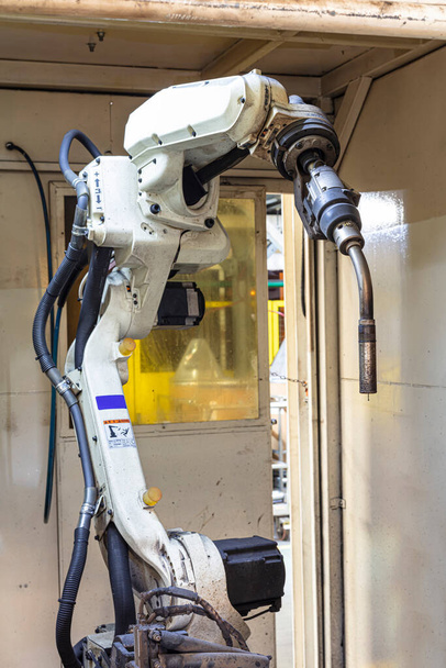 Industrial welding robots in the automotive parts production line in Thailand factories - Fotoğraf, Görsel