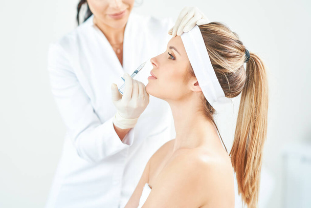 A scene of medical cosmetology treatments botox injection. - Zdjęcie, obraz