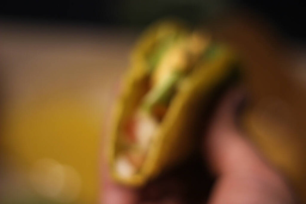 mexican food- taco blur Cheddar cheese sauce  - Фото, изображение