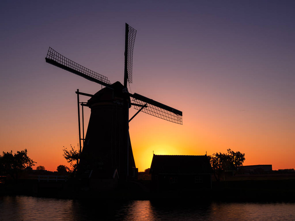 One of the windmills at Kinderdijk that are a group of 19 monumental windmills in the Alblasserwaard polder, in the province of South Holland, Netherlands. - Photo, Image